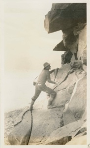 Image of George Borup climbing the Oo-ma-nak